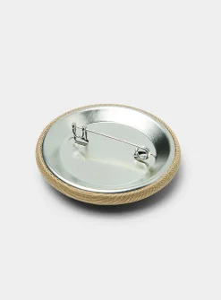 A embroidered badge pin