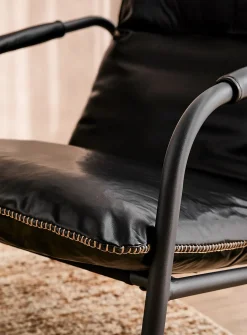 Accent stitching faux-leather lounge chair