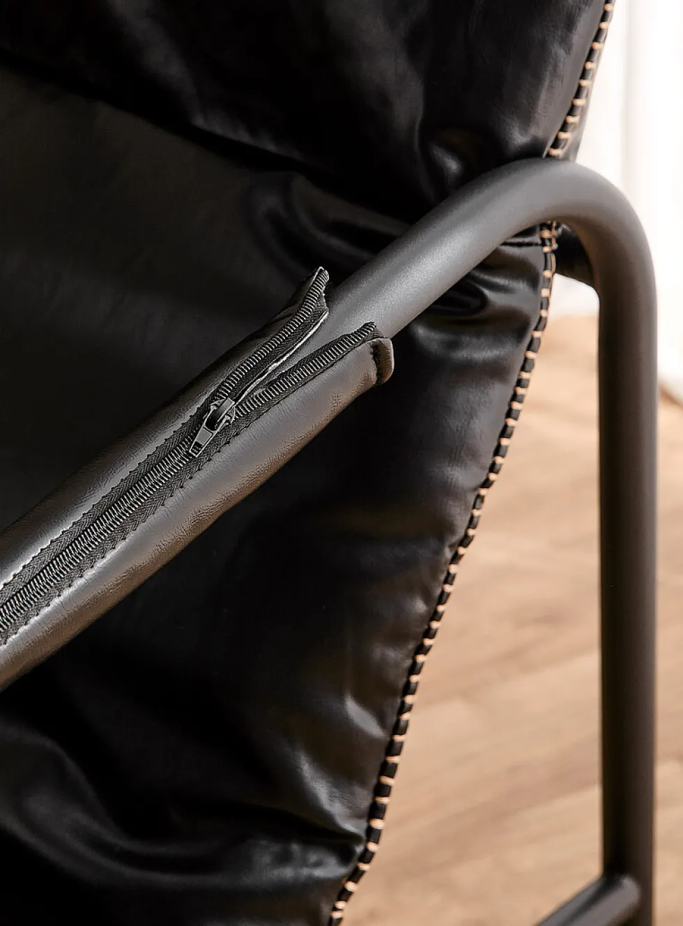 Accent stitching faux-leather lounge chair