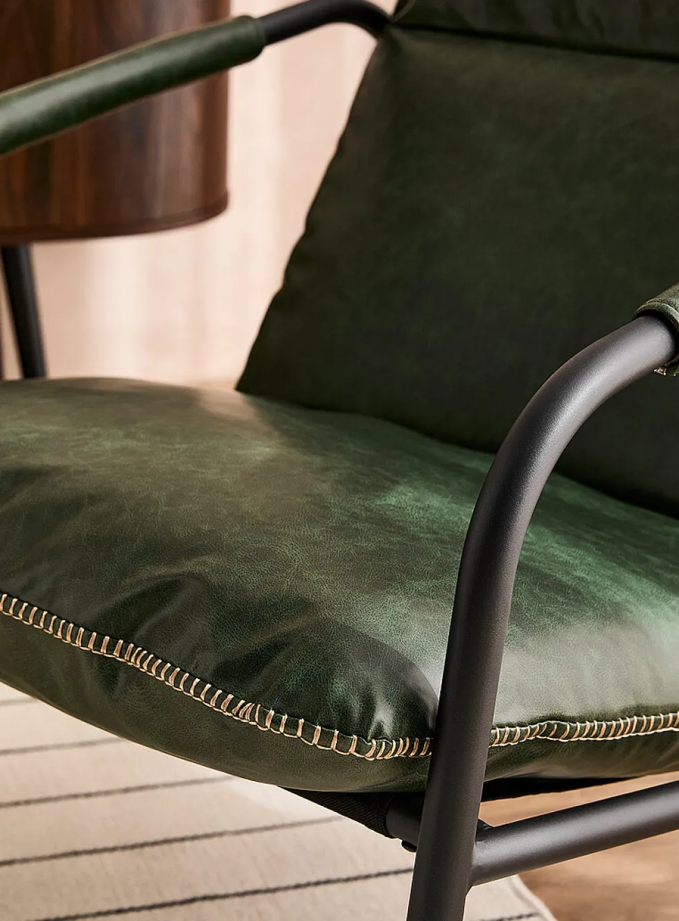 Accent stitching faux-leather lounge chair