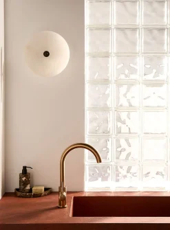Alabaster saucer wall sconce