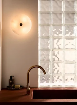 Alabaster saucer wall sconce