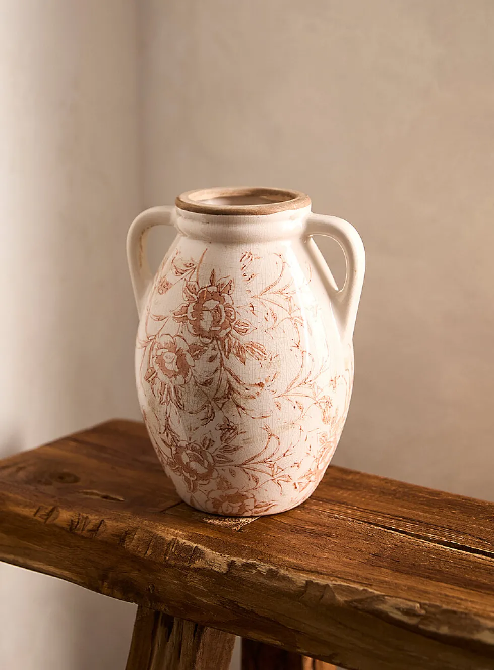 Ancient flowers handled vase