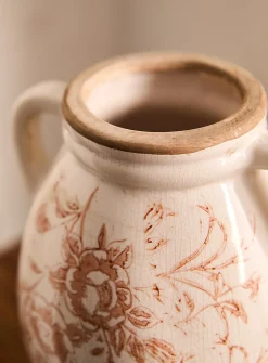 Ancient flowers handled vase