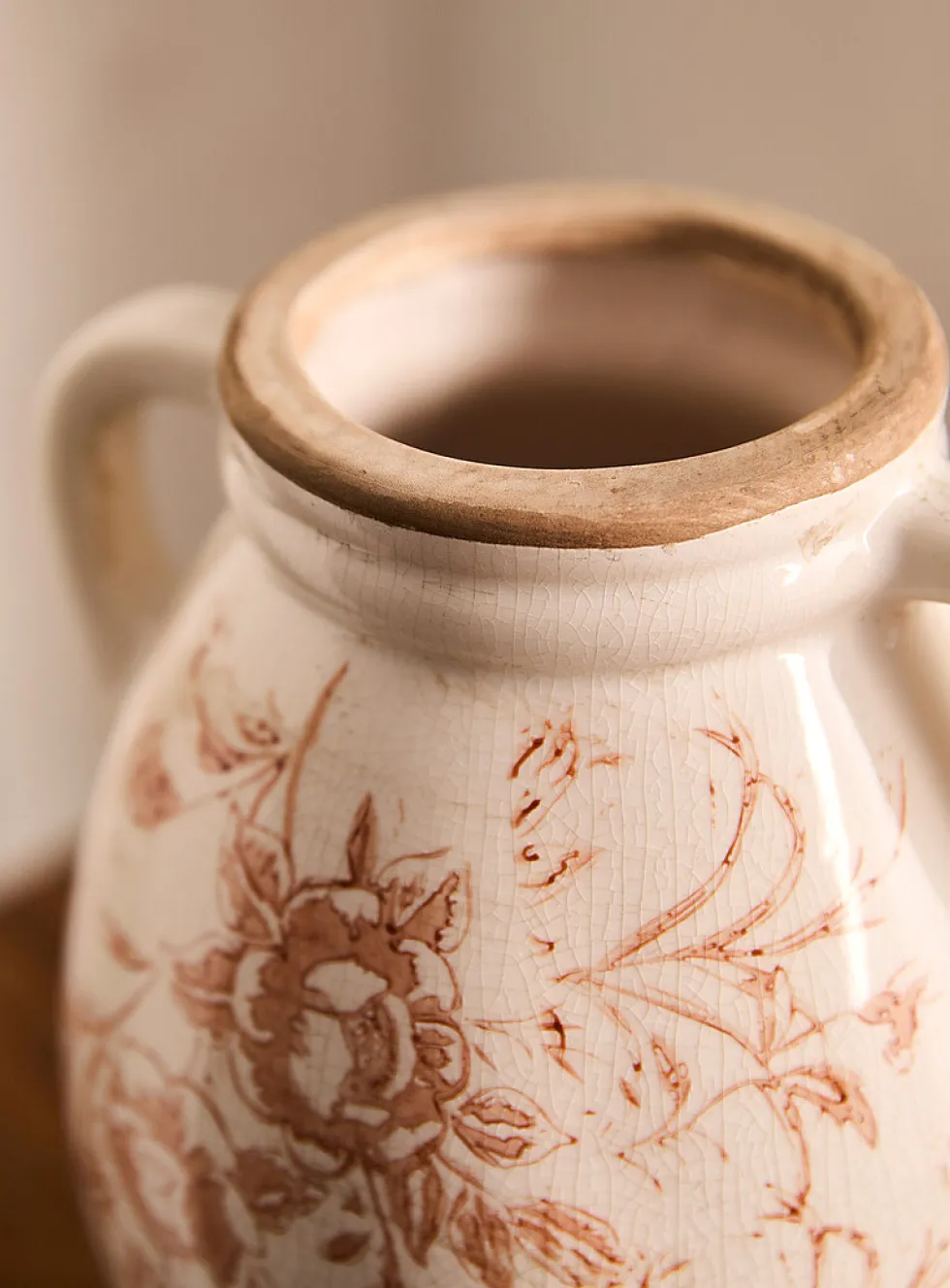 Ancient flowers handled vase