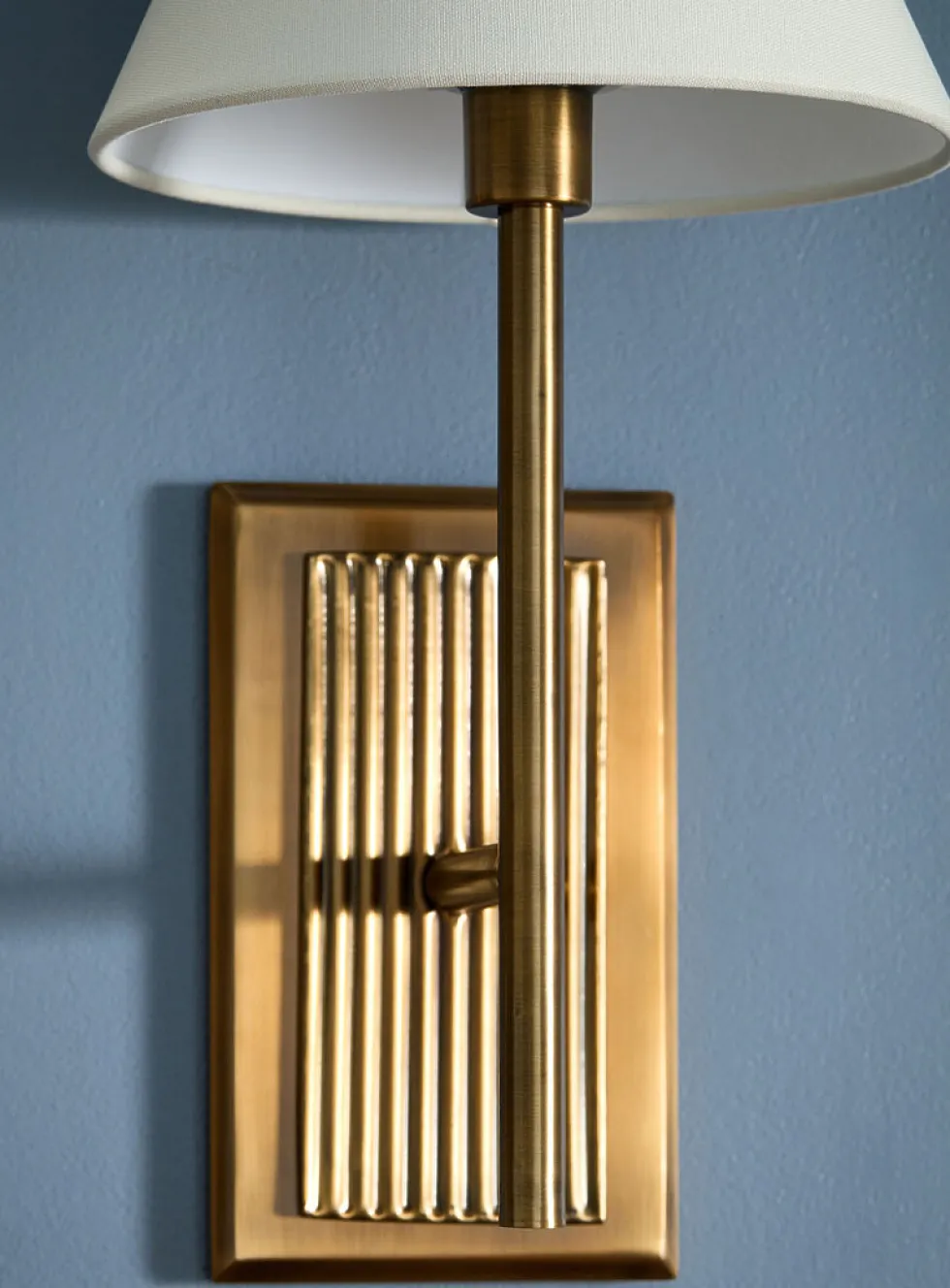 Antique brass finish fluted sconce