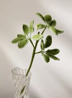 Artificial green leaves crocheted branch