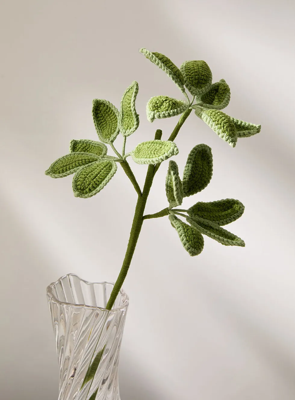 Artificial green leaves crocheted branch