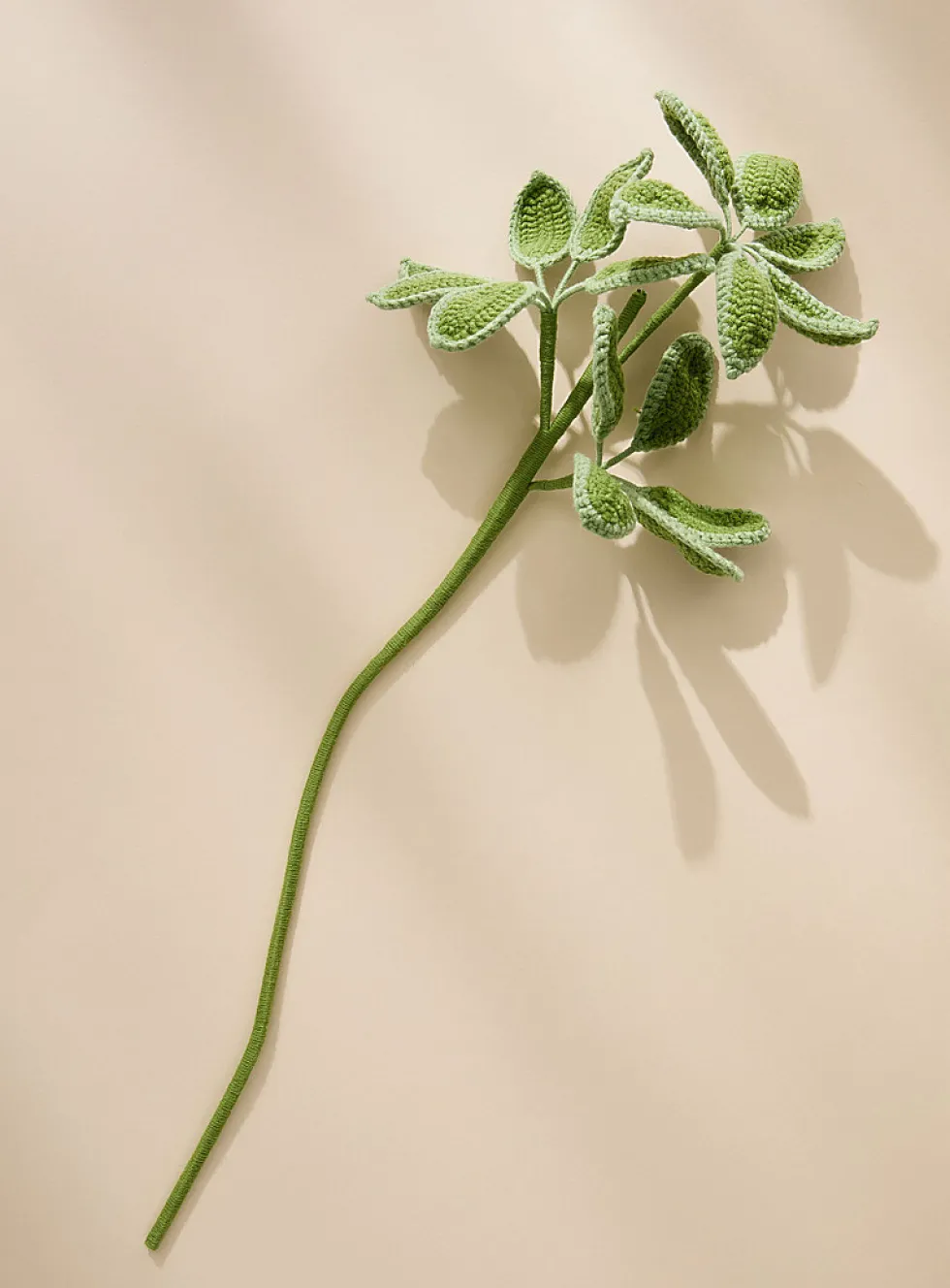Artificial green leaves crocheted branch