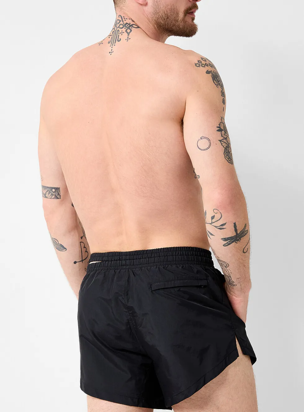 Asymetrical opening swim short
