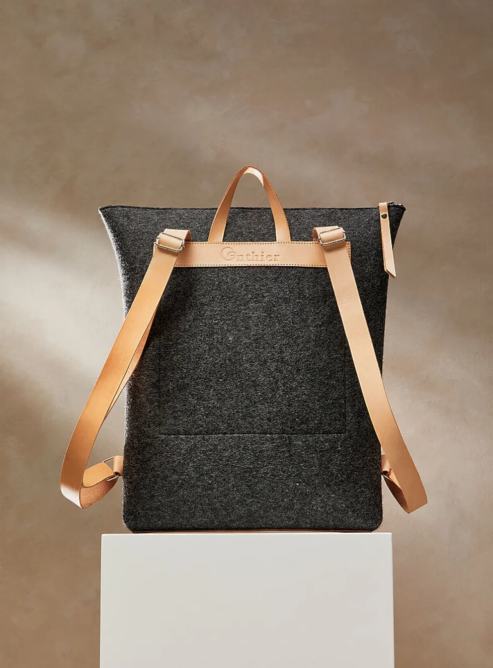 Auguste leather and wool felt backpack