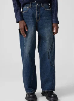 Beaded lyrics curved-seam jean