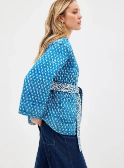 Belted reversible quilted jacket