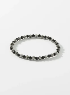 Black bead and grooved cross bracelet