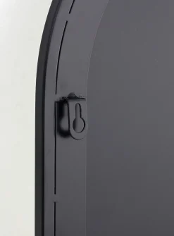 Black metal arched mirror with shelf