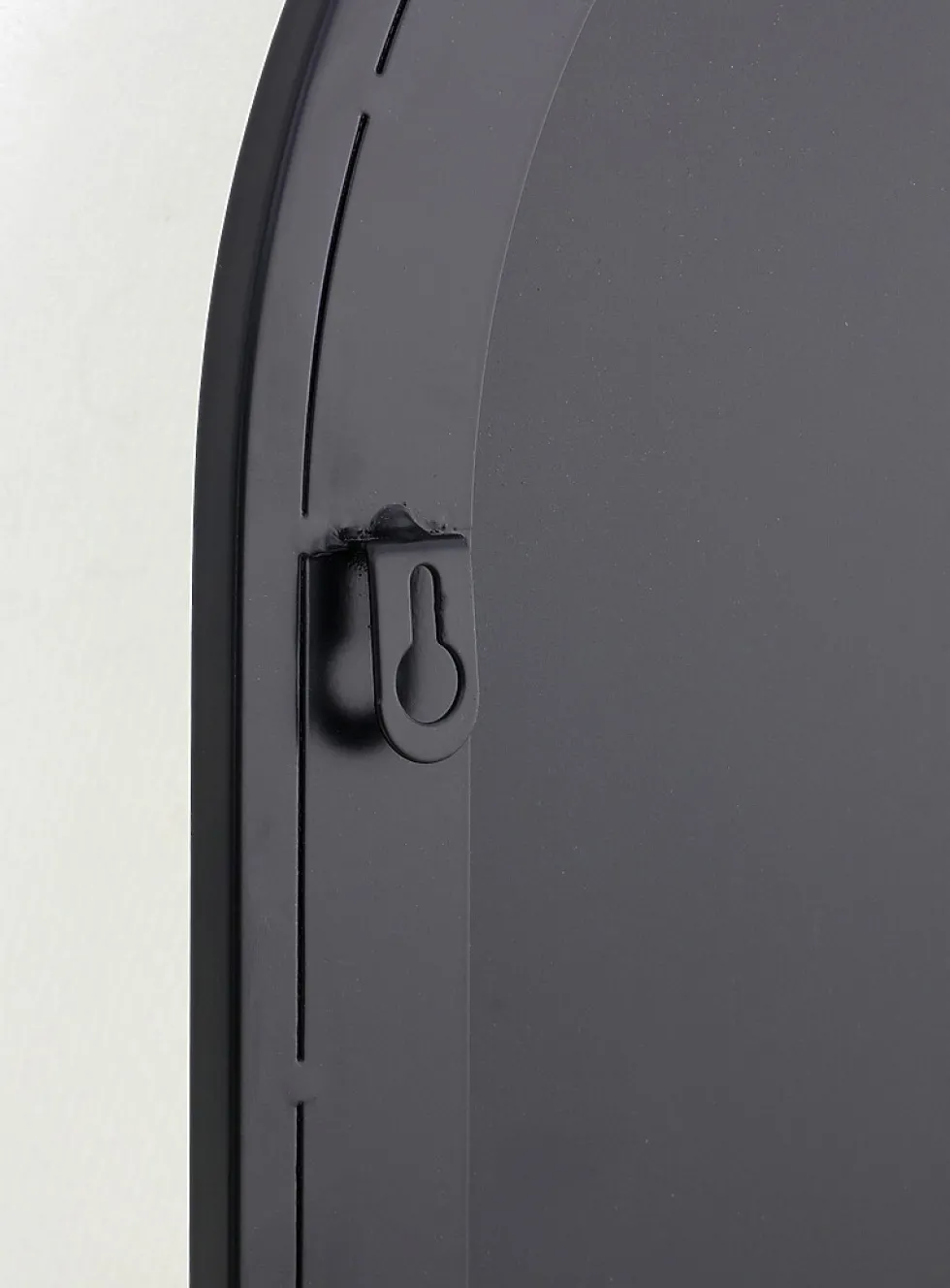 Black metal arched mirror with shelf