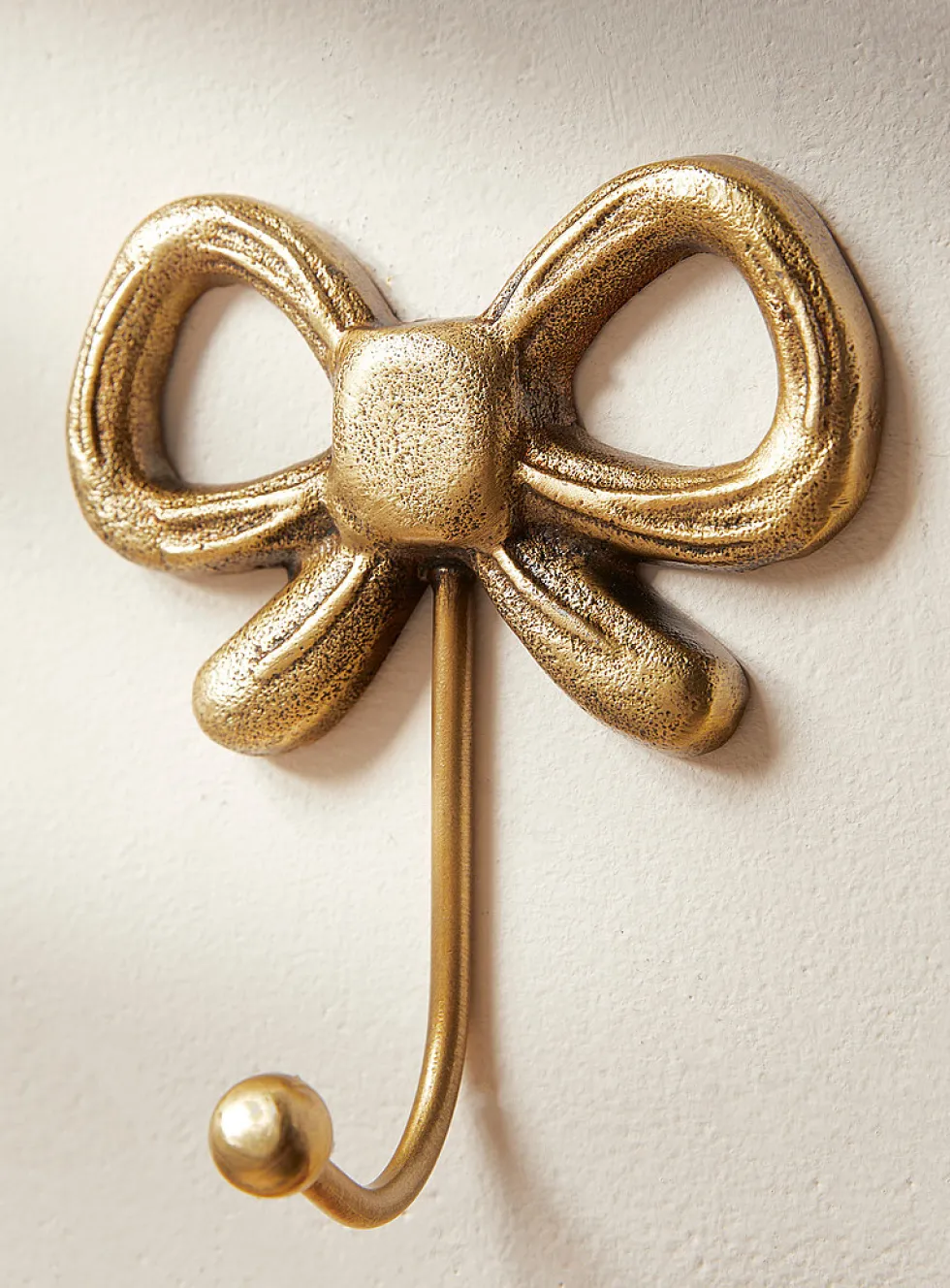 Bow wall-mounted hook