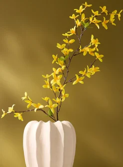 Bright yellow artificial forsythia branch