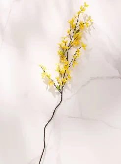Bright yellow artificial forsythia branch
