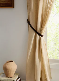 Brown leather curtain holders