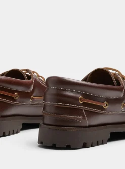 Brown leather notched boat shoes