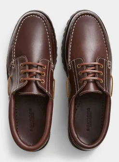 Brown leather notched boat shoes