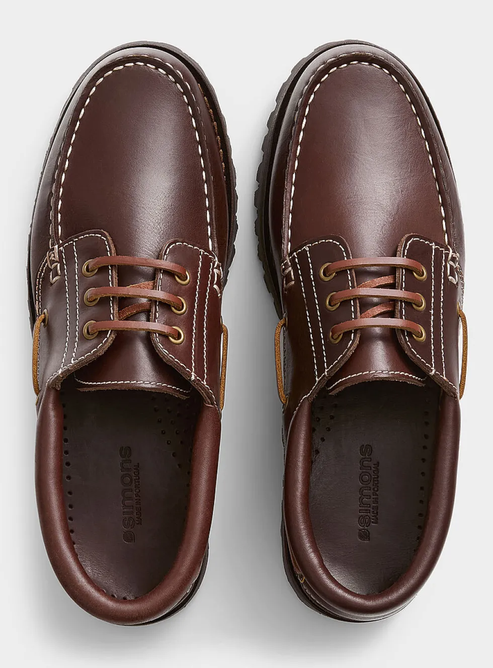 Brown leather notched boat shoes