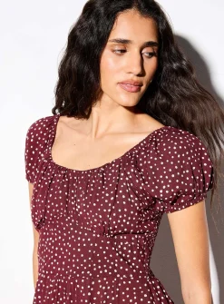 Bustier-style polka-dotted brown dress