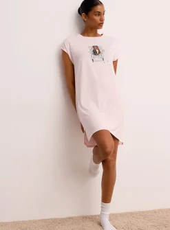 Canine drawing flowy nightgown