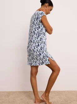 Canine drawing flowy nightgown