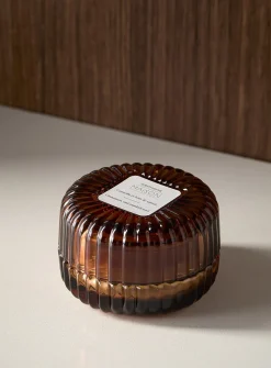 Cinnamon and sandalwood scented candle