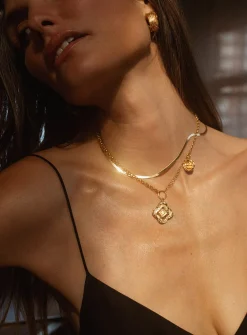 Colliding compass necklace