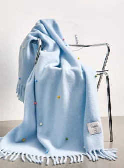 Colourful pompoms sky-blue faux-mohair throw