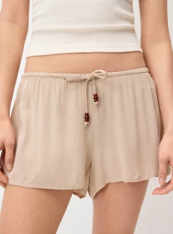 Crinkled elastic-waist mini short
