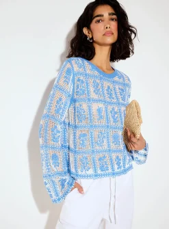Crocheted blue flowers openwork sweater