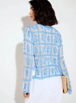 Crocheted blue flowers openwork sweater