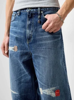 Distressed dark-blue jean