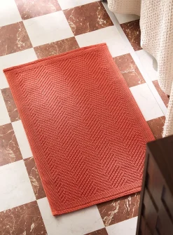 Embossed knots chevron bath mat