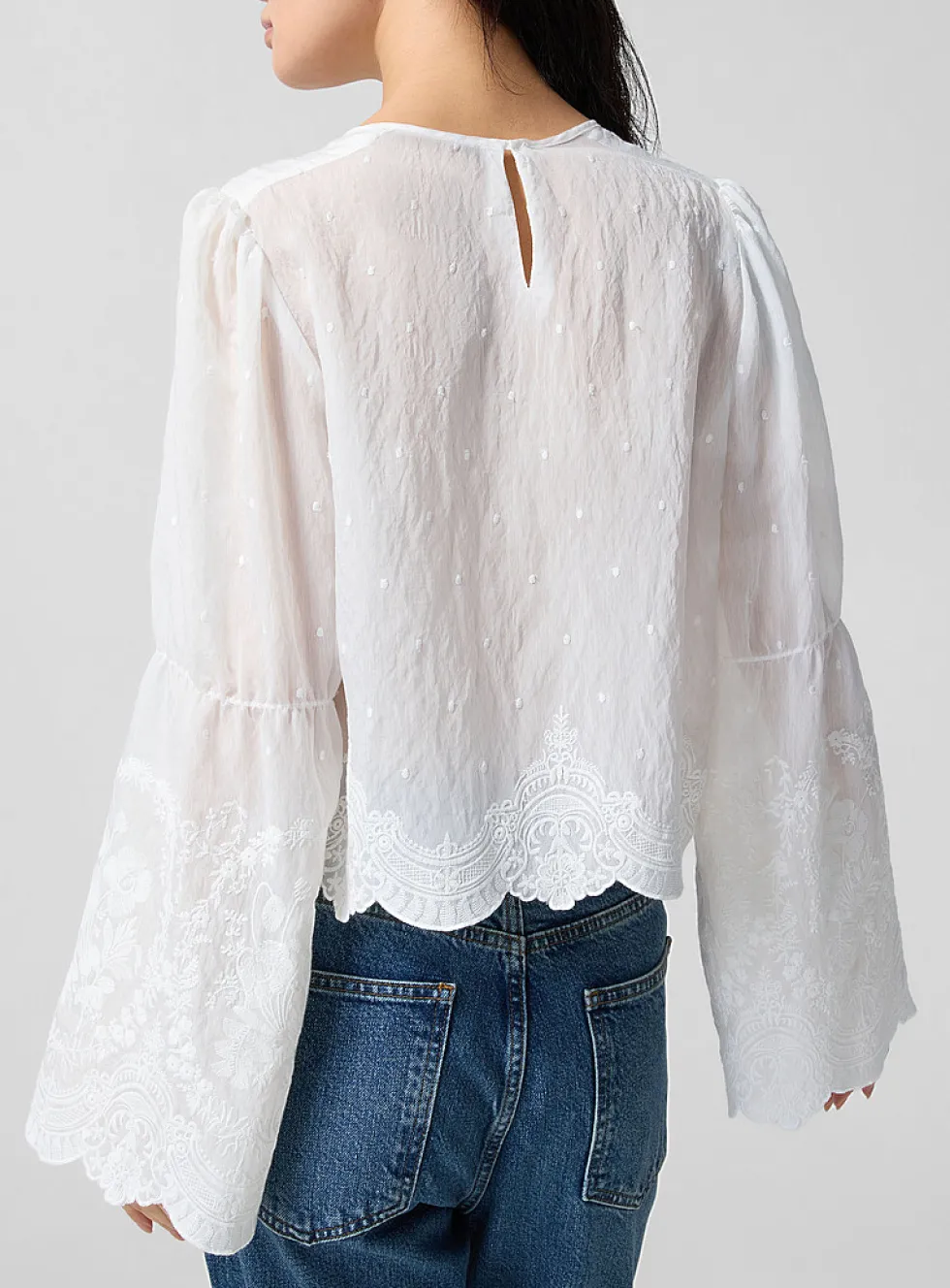 Embroidered bell-sleeve blouse