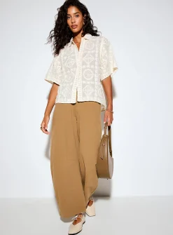 Embroidered pattern and mini-beads shirt