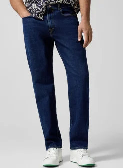 Embroidered pocket stretch tapered jean