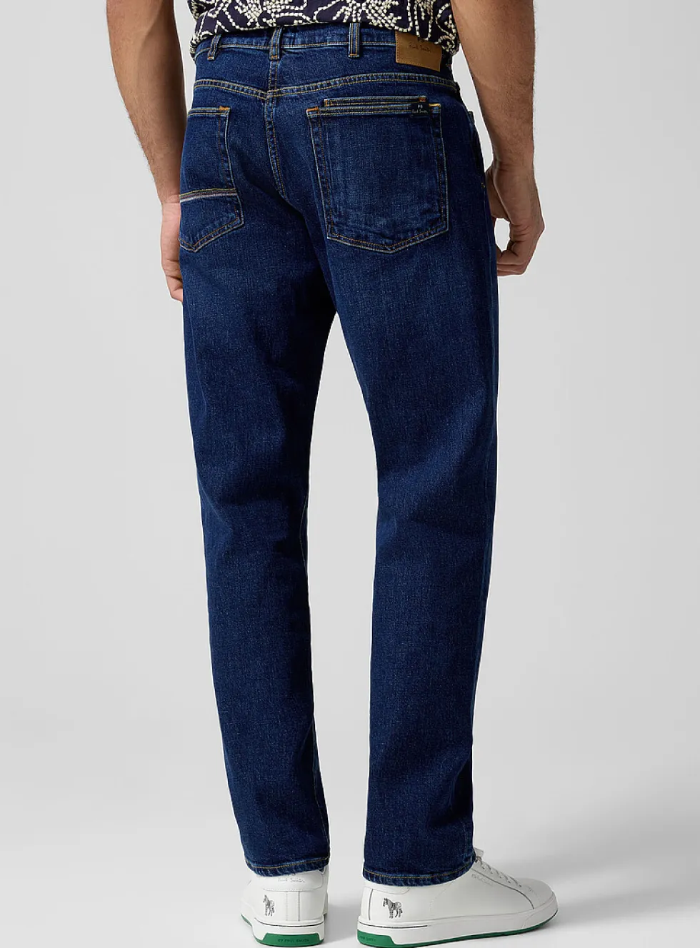 Embroidered pocket stretch tapered jean