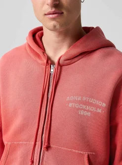 Faded red zip-up hooded sweatshirt