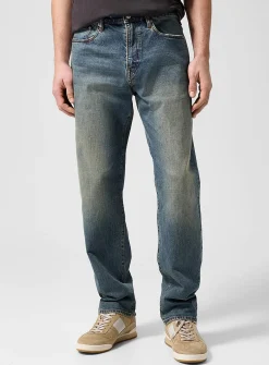 Faded sand tone tapered jean