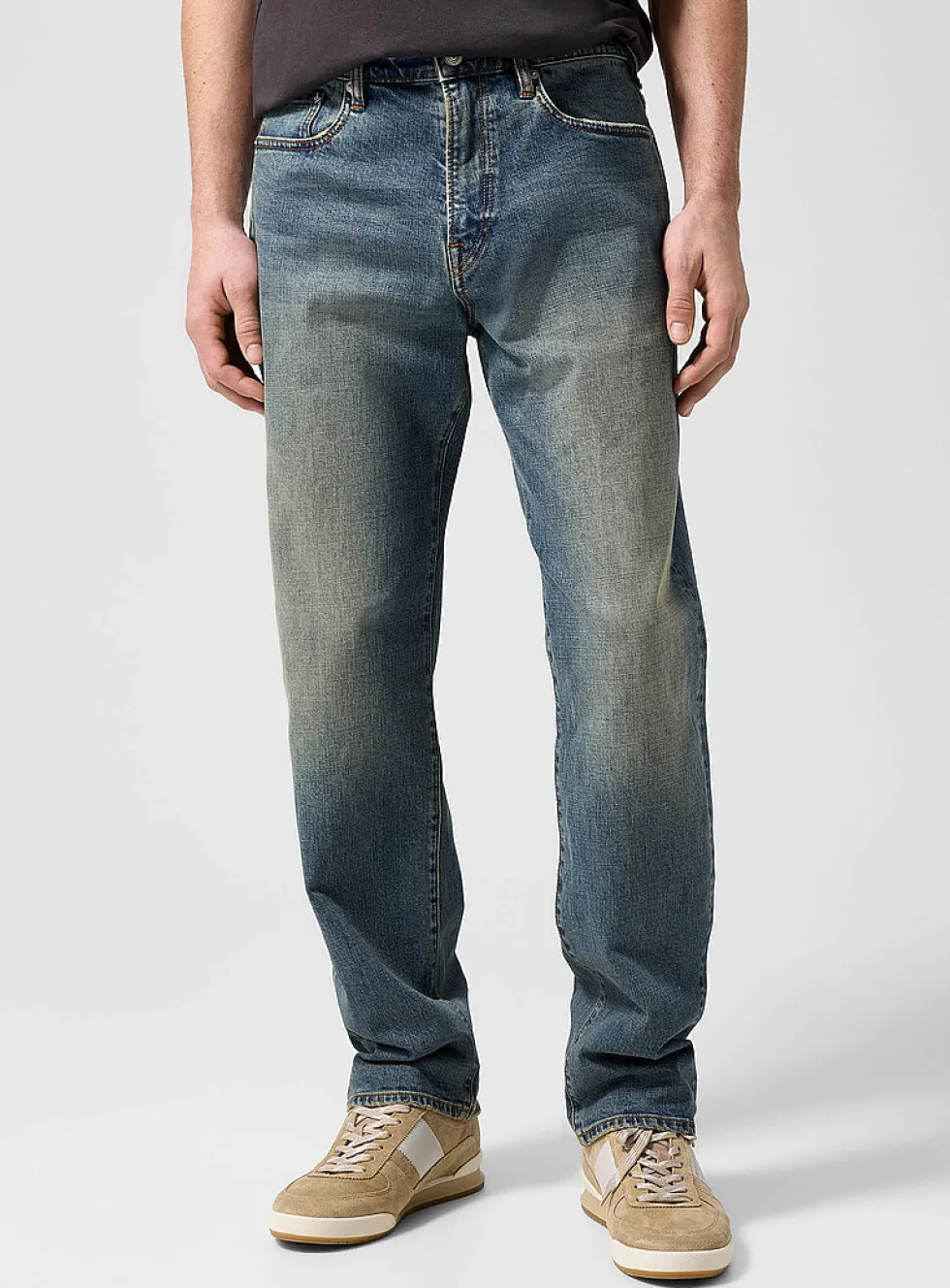 Faded sand tone tapered jean