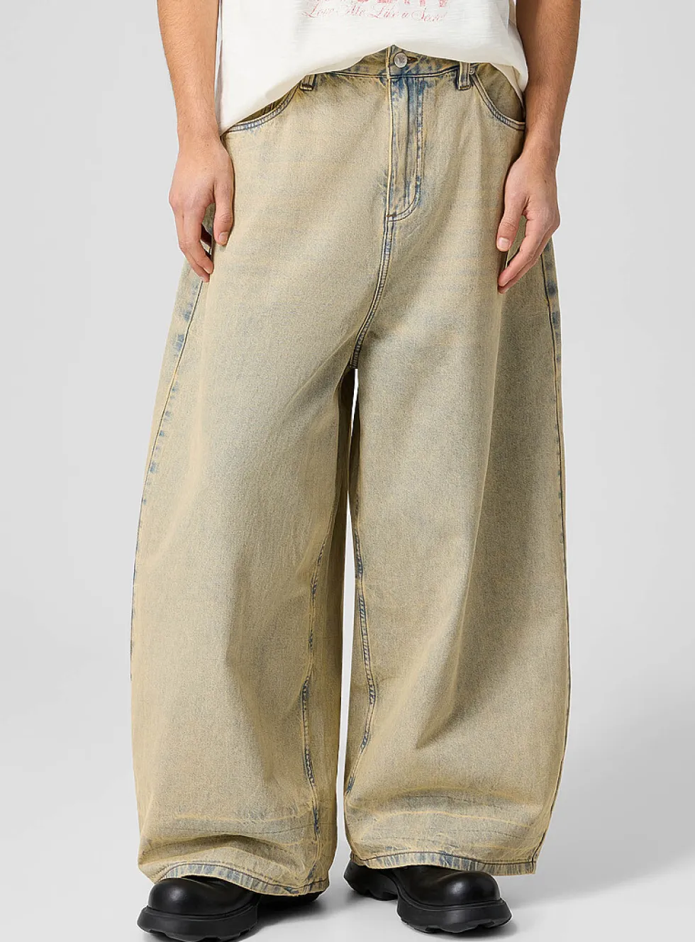 Faded sandy tone barrel-leg jean