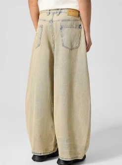 Faded sandy tone barrel-leg jean