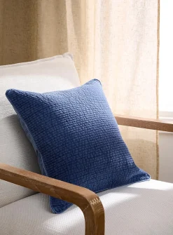 Faded-look quilted cushion with removable cover