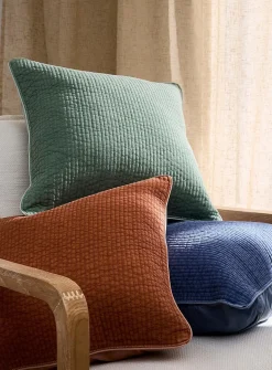 Faded-look quilted cushion with removable cover