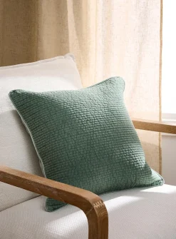 Faded-look quilted cushion with removable cover